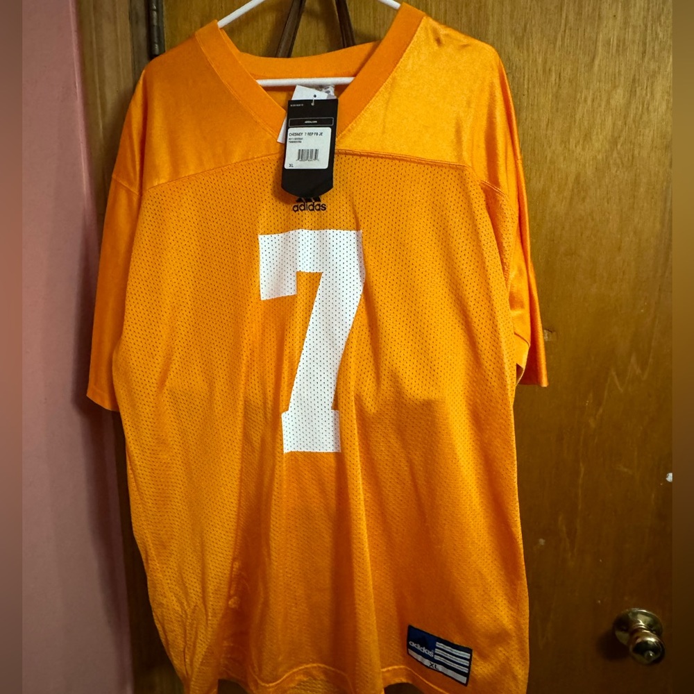 Authentic NFL football jersey. Size XL. Orange for the Univ. of Tennessee.